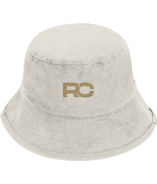 Natural Raw/Off White and gold rave bucket hat with embroidered RC logo, front view